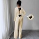 Women's suit with a hollowed-out bow at the back, 2025 summer elegant round-neck long-sleeved top and trousers, two-piece set. Women's suit with a hollowed-out bow at the back, 2025 summer elegant round-neck long-sleeved top and trousers, two-piece set.
