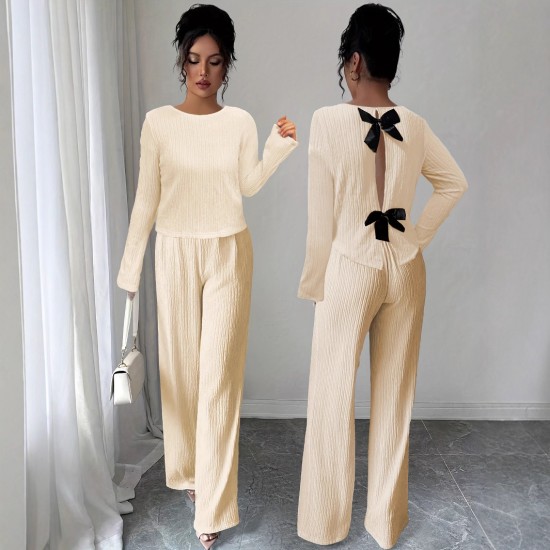 Women's suit with a hollowed-out bow at the back, 2025 summer elegant round-neck long-sleeved top and trousers, two-piece set. Women's suit with a hollowed-out bow at the back, 2025 summer elegant round-neck long-sleeved top and trousers, two-piece set.
